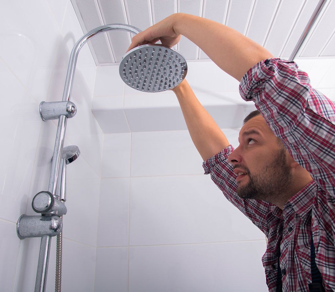 plumber fixing a shower